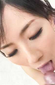 Manami Komukai Asian strokes dick while sucking it with passion